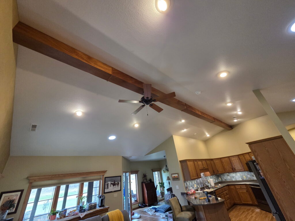 African Royal Mahogany ceiling beam installed by CNT Builders with custom carpentry services in Spearfish, SD.
